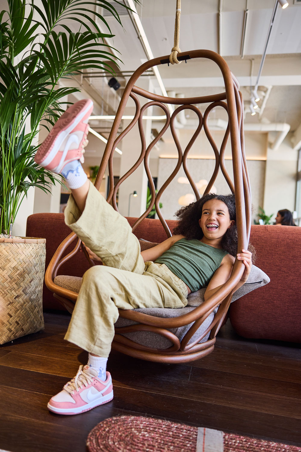 girl on a swing in lobby